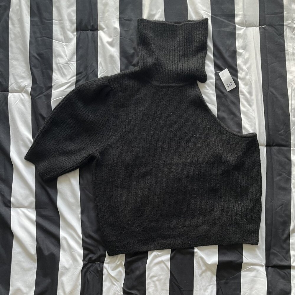 Sweater so nice. I bought it twice. Gap black sleeveless sweater size large